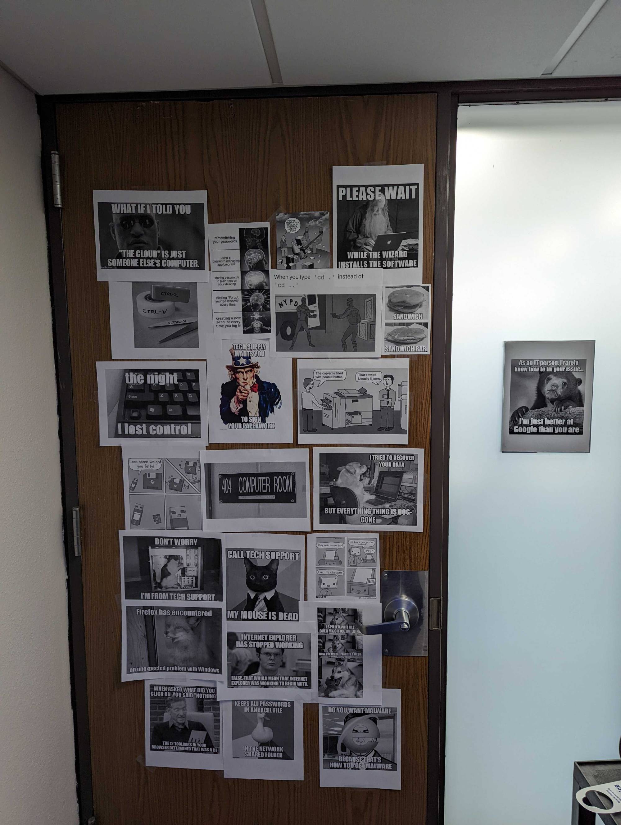 wooden door with black and white photos/memes taped to it
